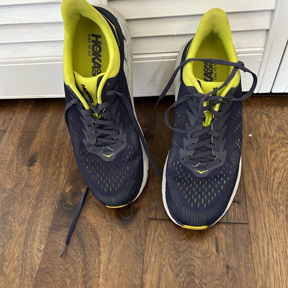 Hoka One Men’s running shoes. Size 9.5. Dark blue with bright yellow accent